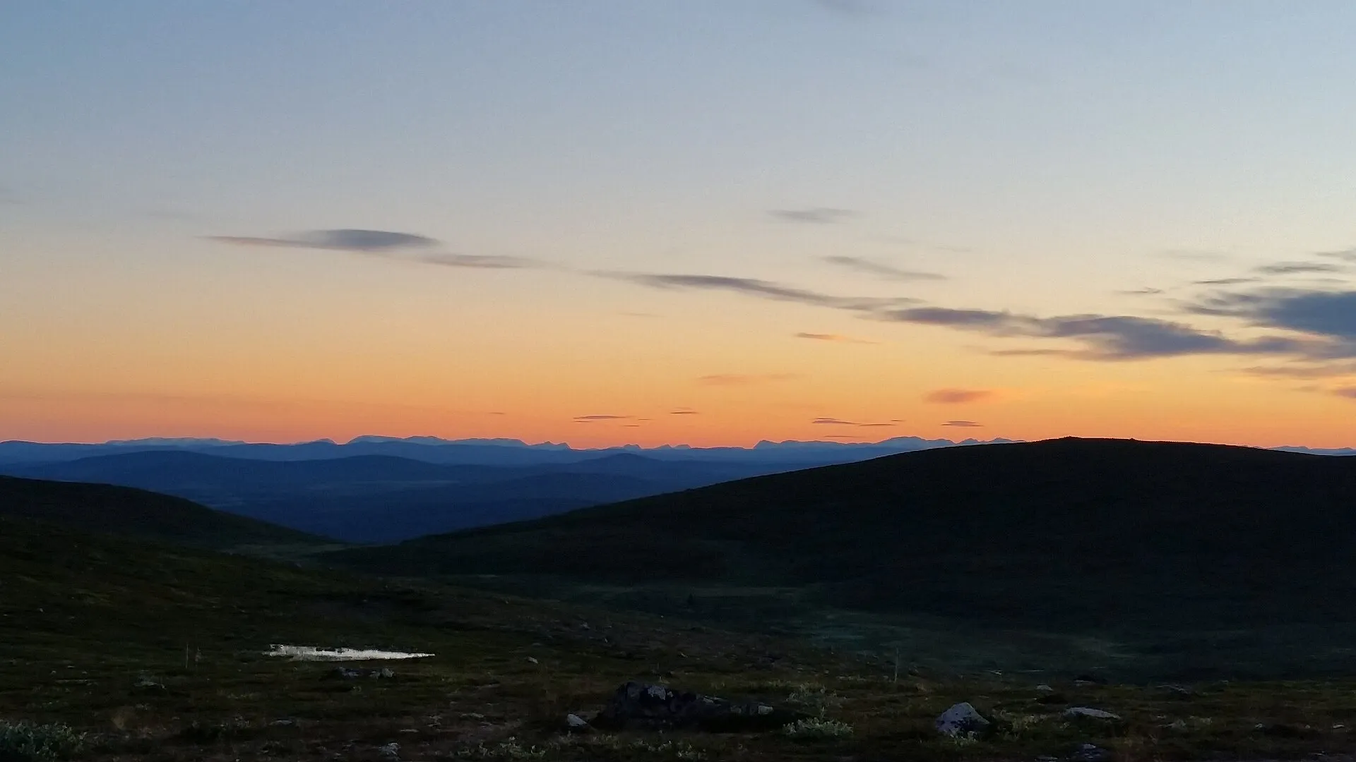Solnedgång över fjällen sedd från Dundret i Gällivare